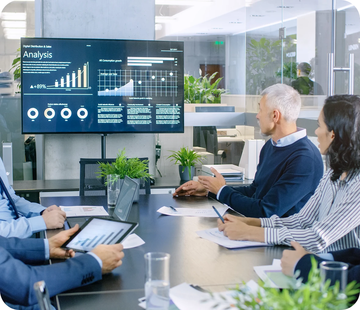 Business meeting with data analysis presentation.
